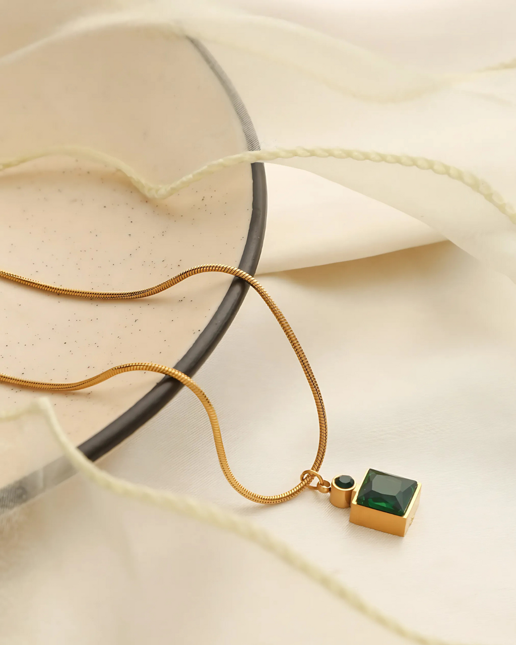 Gold green stone pendant